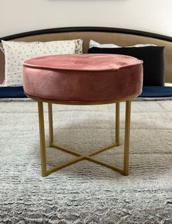 Pink round chair with gold metal base