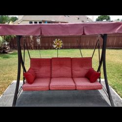 Beautiful red 3 seat outdoor swing with canopy