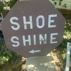 a metal shoe shine sign its 30 inches tall and 30 inches wide