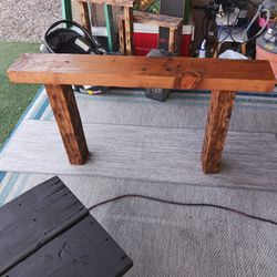 Beautiful Rustic wooden solid stand /Home Decor has a pretty cherry stain on the top and has been burned on the legs sturdy must pick up Broadway and 