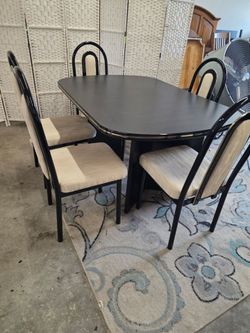 Black Dining Table and chairs. 
Delivery options available