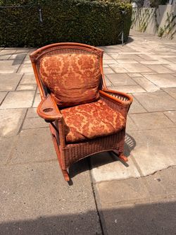 Rattan rocking chair with down cushions