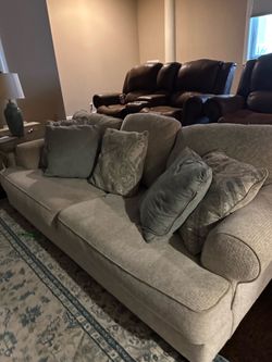 Ashley’s Beige Fabric Sofa and Loveseat Set
