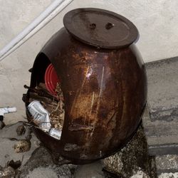 Vintage steel fire pit with removable top.