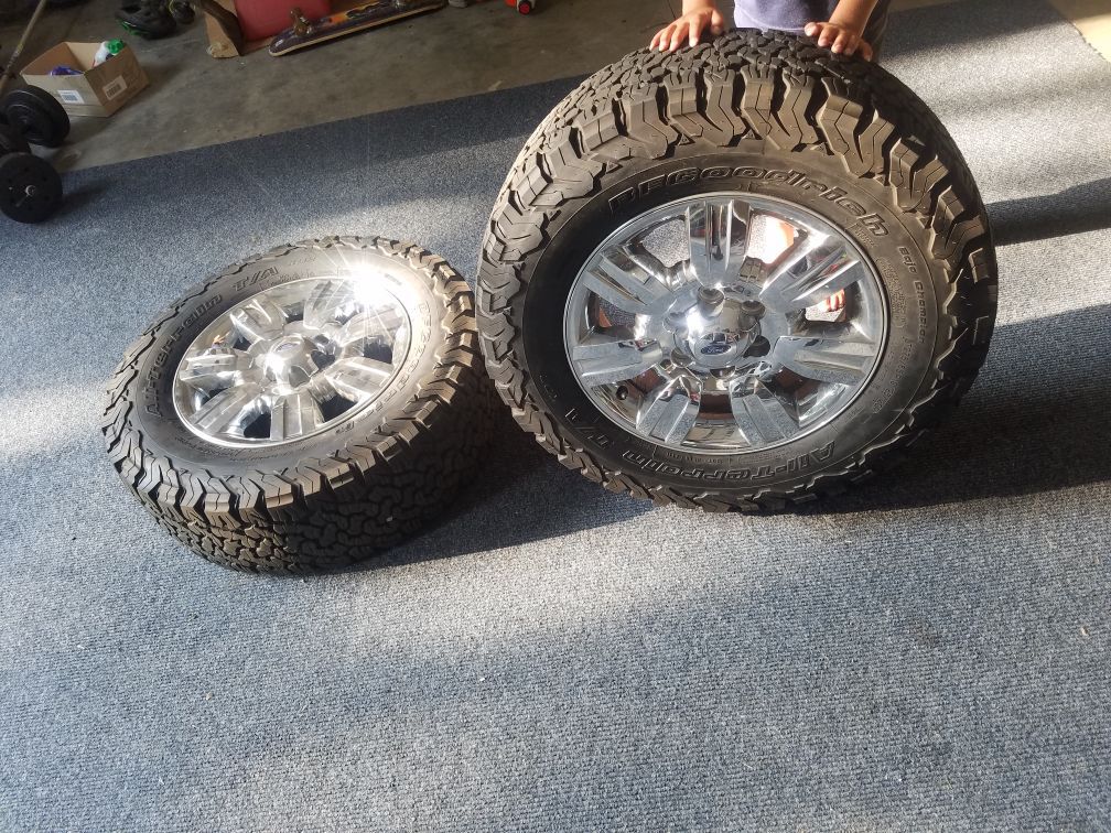 Brand new BF Goodrich tires with chrome Ford wheels