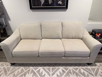 Living Spaces light tan MESA FOAM II SOFA