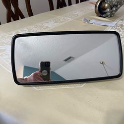 Large truck mirror in good condition, includes mounting screws. It measures 16 1/2 inches in length and 8 inches in width.