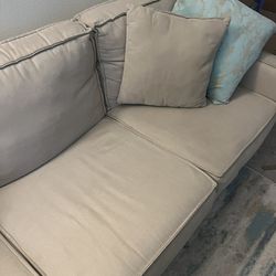 Tan 3 Cushion Couch W/ Pillows