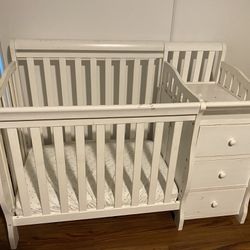 White Baby Crib with Attached Drawers