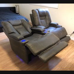  Leather Power Recliners 3 adjustable types of support: head, back and feet. Fully reclinable chairs with USB charger.  Sleek, mod $475 each.  Sof