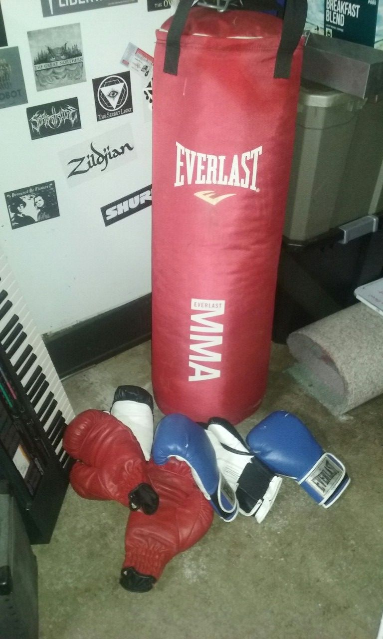 70 lb heavy bag and 3 pairs of boxing gloves
