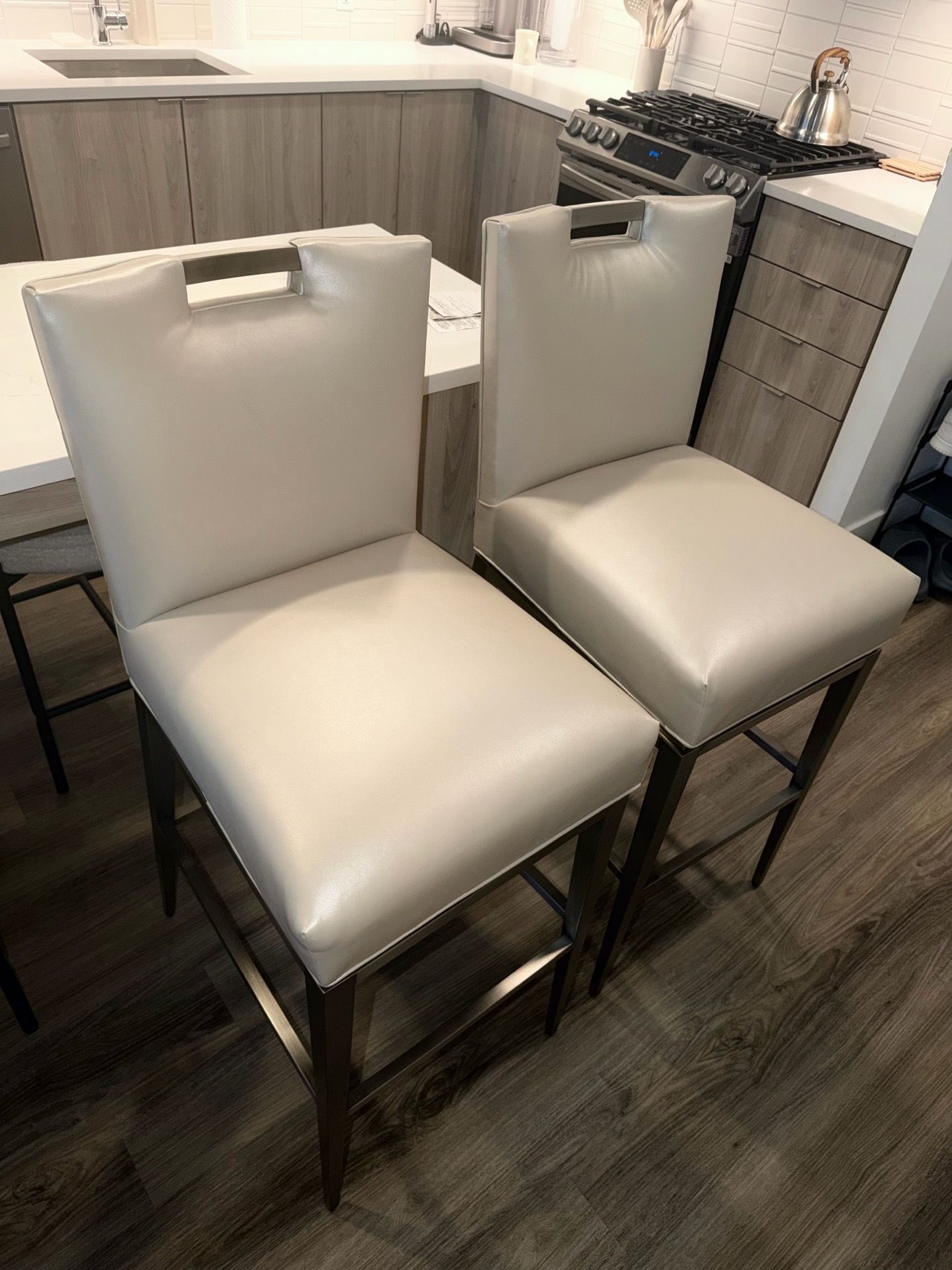 High-end swivel bar stools from a premium furniture collection.
