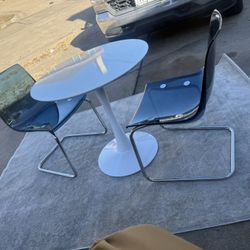 Ikea white roubd  Table DOCKSTA With 2 Acrilyc Chairs.