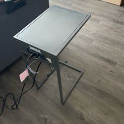 C shaped side table with charging station