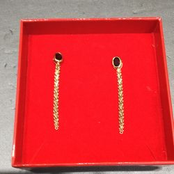 Gold earrings with red stones