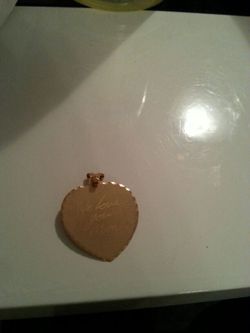 Heart pendant we love you MoM engraved on it