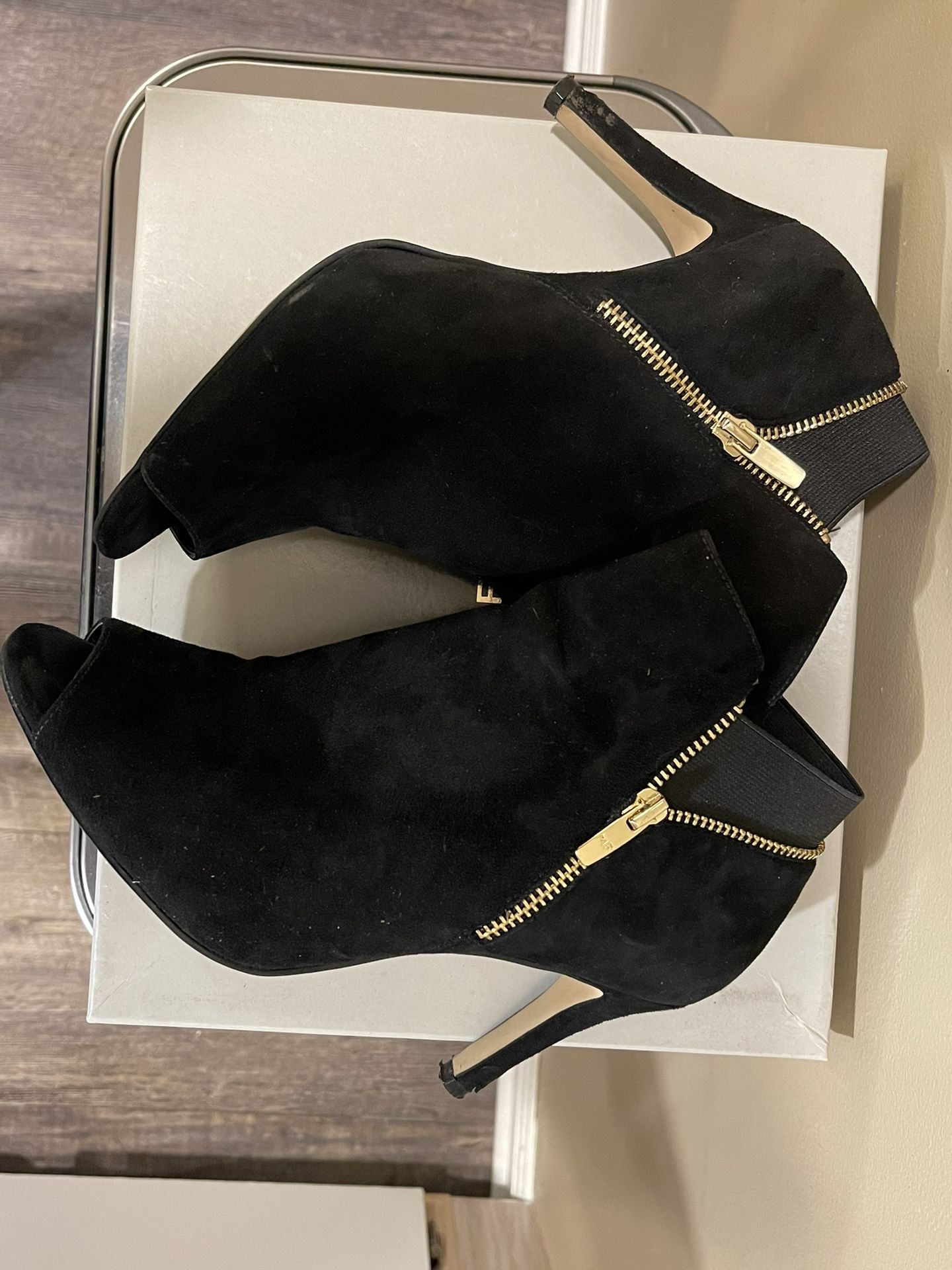 Marc Fisher Black suede booties with a peep toe and gold zippers. Size 8.5w