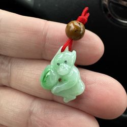 jade monkey pendant with red string