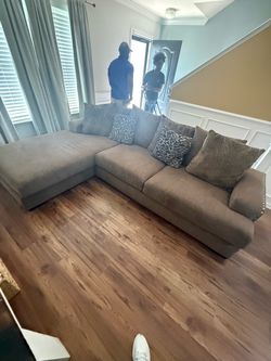Ashley furniture 60 day old L shape sectional w/ throw pillows. $600. Will deliver for a fee.