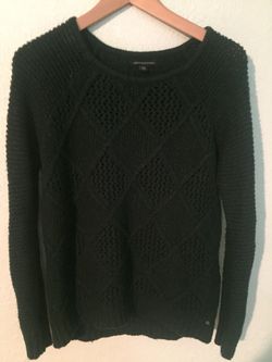 Knit sweaters and a pair of jeans