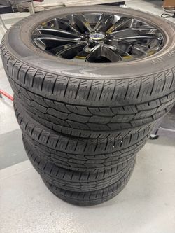 Ford Expedition 20” OEM black wheels and tires
