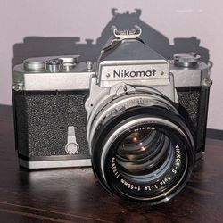 Rare Vintage Nikon Nikomat 35mm SLR Film Camera w/Nikon NIKKOR 50mm 1.4 lens. Made in Japan. Comes with original Nikon case. 