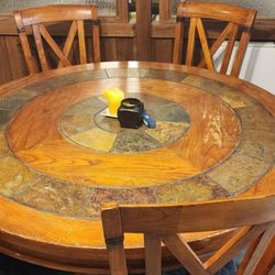 Round dining table with six chairs