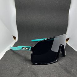 Oakley Sutro Sunglasses Black Frame W/ Prizm Polarized Lens & Cyan Arms