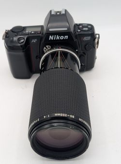 Nikon N8008 film camera. Comes with a NIKKOR 80-200mm 1:4 zoom lens.