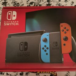 NEW...Nintendo Switch™ w/ Neon Blue & Neon Red Joy-Con