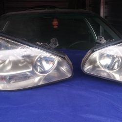 2002 Infiniti. Q 45 Headlight Assembly (left and right)