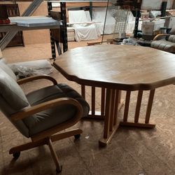 Solid oak table and four chair chairs can be used for dining or gaming