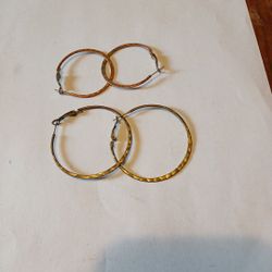 A Pair Of Large And Another Pair Of Medium Hoop Earrings