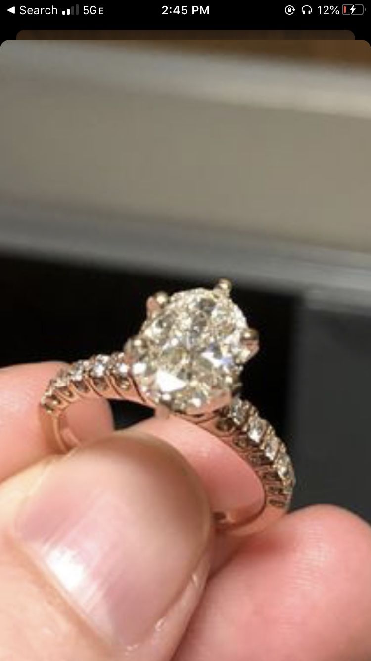 Rose gold diamond engagement ring size 4 and 3/4. Oval shape, 1 .6 ct. Appraisal paperwork shown in provided images.
