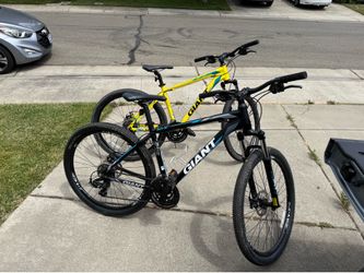 Two matching Giant 27.5 inch mountain bikes