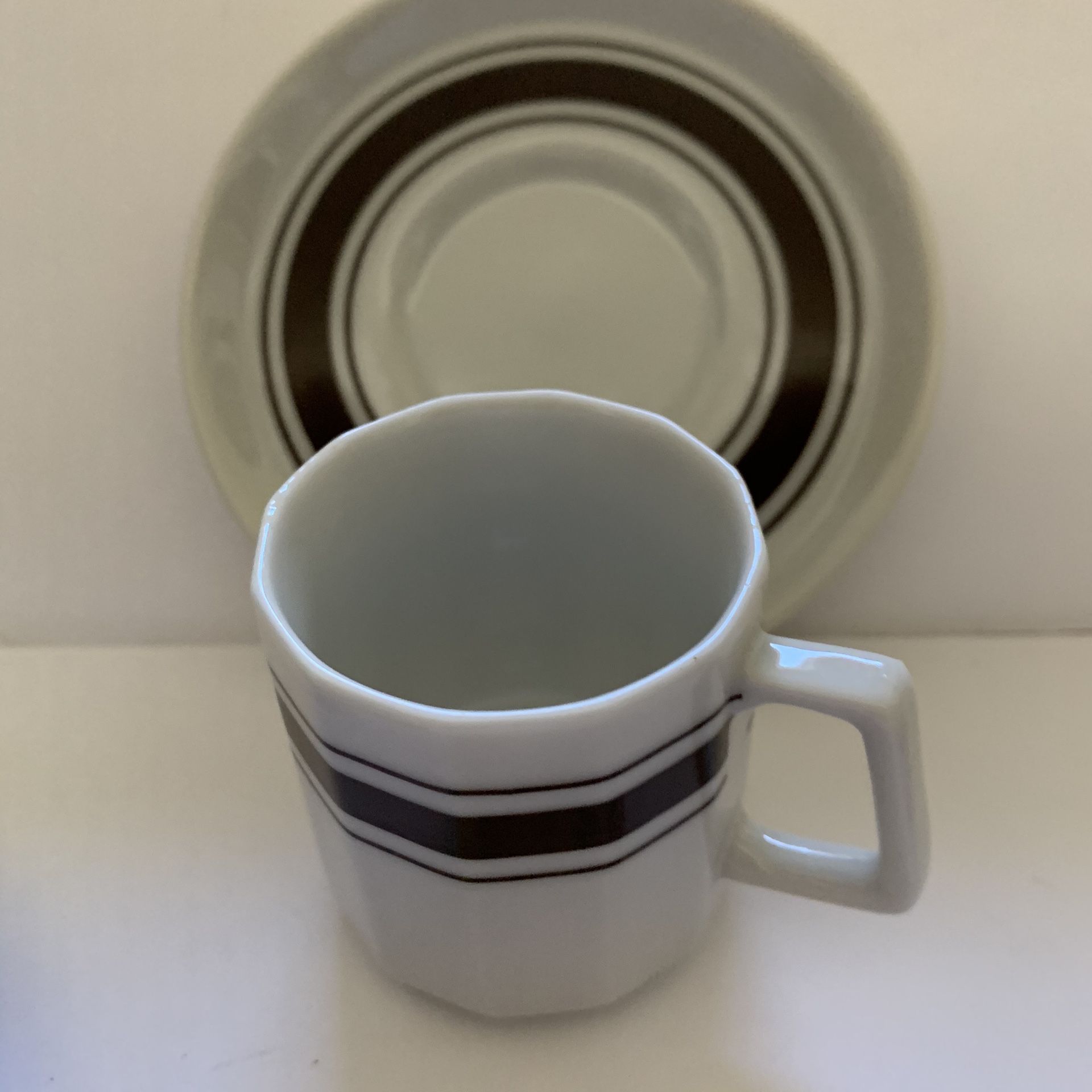 Sets of four specialty coffee cups and saucers