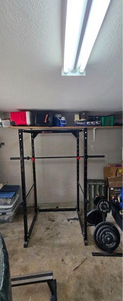 Squat rack with bar and weights
