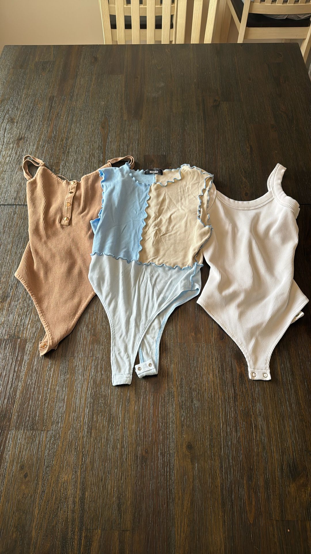Three XS/S Bodysuits