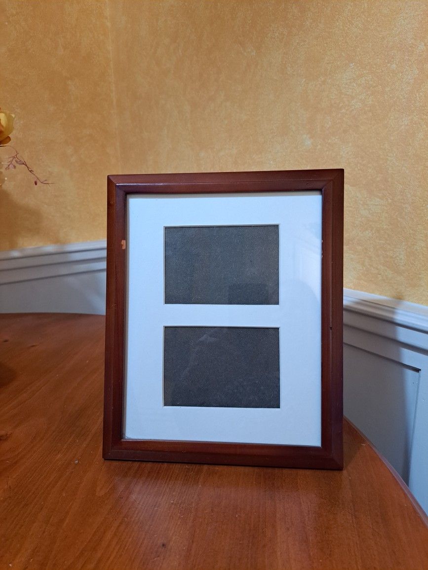 Brown picture frame 9 1/2 in by 11 1/2 in. Holds two 4 by 6 pictures.