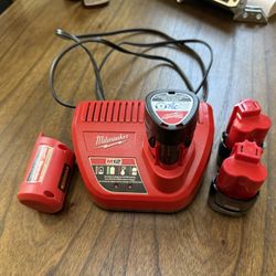 Milwaukee Charging Base, 3 Batteries And Top Off Portable Charger