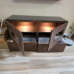 Cabinet With Shelves, Drawers And Doors.  It Has Lights And Glass On Top. 48 W, 16 D, 24 H, Approximately. 