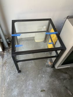 Metal table with glass top 2 of them