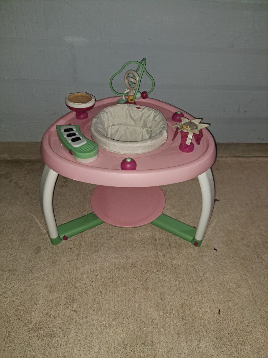 Tiny Love 5-in-1 Stationary Activity Center, specifically the "Here I Grow" model. 