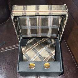 3 piece set - tie with matching handkerchief and cufflinks.Nice Earthtone colors. In original box. Great gift