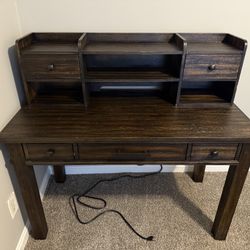 Wooden Desk With Plugs For Charging Devices 