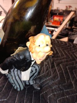 Butler carrying a wine bottle