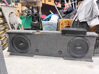Dual Skar 12s with a qbomb box and a Skar 1200 watt amp