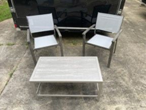 New, Firm, Foxborough Patio Coffee Table Gray with 2 Ryegate Weathered Teak Patio Sling Dining Chairs