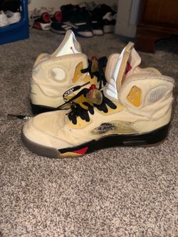 Nike Air Jordan 5 Retro Off-White Sail sneakers, featuring a unique cream-colored textile upper with bold black "SHOELACES" branding.