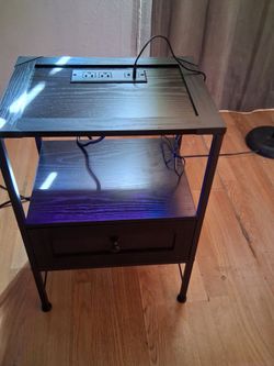 Modern Black Nightstand with Charging and Drawer